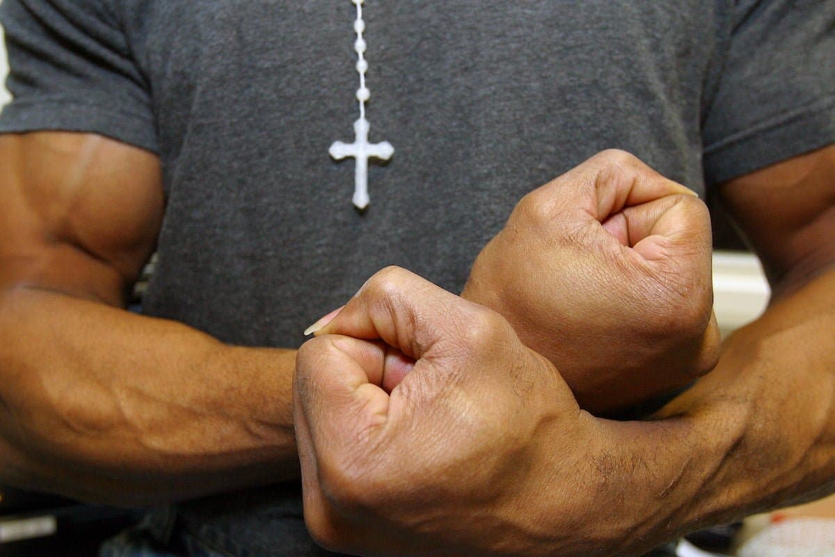 A prisoner flexes his muscles. HMP Wandsworth