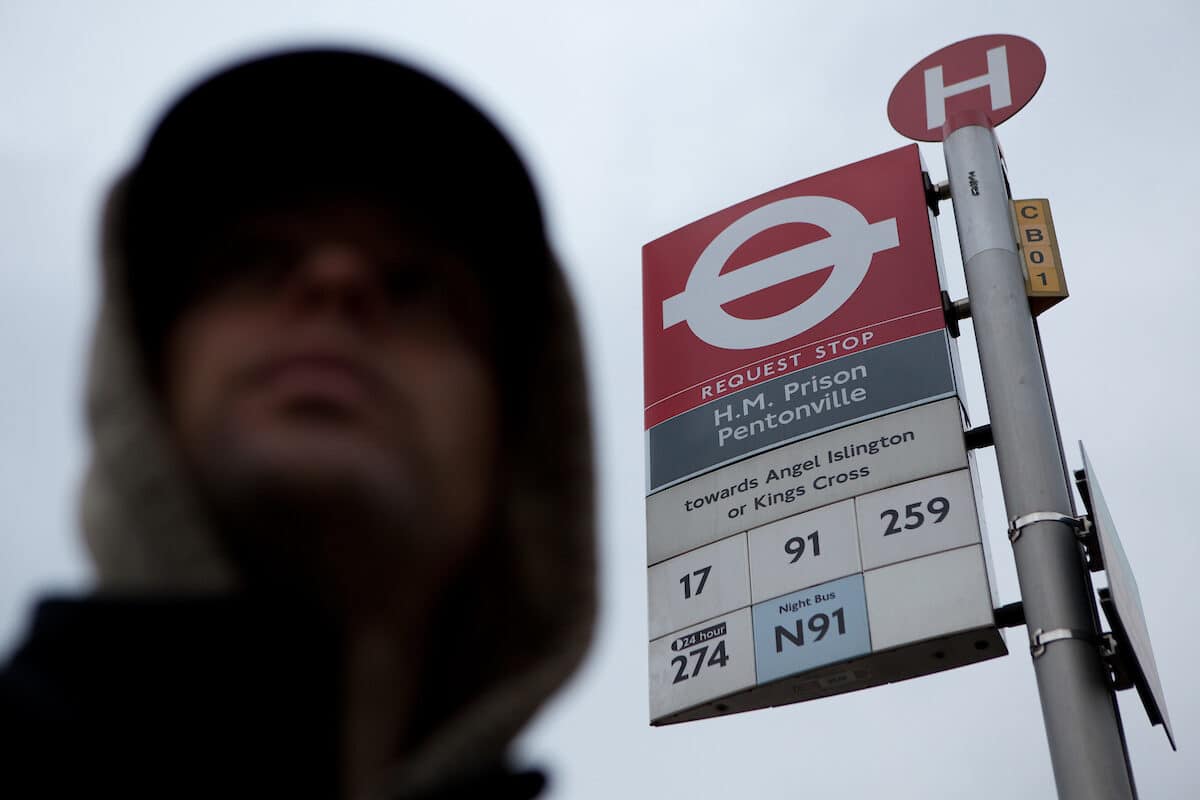 prisoner at bus stop